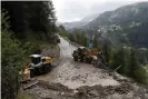  ??  ?? Organisers shortened stage 19 for the riders’ safety when a sudden, violent storm made the route through the Alps too dangerous. Photograph: Thibault Camus/AP