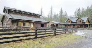  ??  ?? The barn, at left, woodshed and home, right, are covered with 38 large solar panels. “Even on a pretty crummy, rainy February day, we create seven to eight kilowatts,” Williamson says.