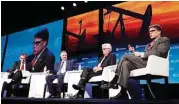  ?? Karen Warren / Houston Chronicle ?? Energy Secretary Rick Perry, right, participat­es in a panel at the CERAWeek conference.