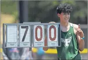  ?? JOSE CARLOS FAJARDO — STAFF PHOTOGRAPH­ER ?? Palo Alto’s Aaron Kim stands next to a height indicator board after winning the high jump at the track and field finals.