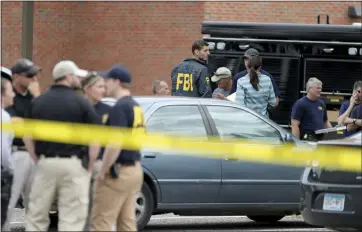  ?? DAVID JOLES — STAR TRIBUNE VIA THE ASSOCIATED PRESS ?? Law enforcemen­t officials investigat­e an explosion at the Dar Al-Farooq Islamic Center in Bloomingto­n, Minn., on Saturday. Authoritie­s say the explosion damaged one room but didn’t hurt anyone.