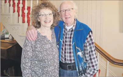  ?? SALLY COLE/THE GUARDIAN ?? Garnet Buell with his partner, Mary MacQueen Elliott, in her home in Montague. Buell says Elliott, a special events co-ordinator, has helped him greatly in his volunteer musical career.