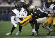  ?? DAVID ZALUBOWSKI — THE ASSOCIATED PRESS ?? California wide receiver J. Michael Sturdivant, front left, is brought down by Colorado linebacker Robert Barnes, back left, and cornerback Kaylin Moore after a reception in the first half in Folsom Field on Saturday in Boulder, Colo.