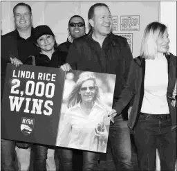  ?? ADAM COGLIANESE/NYRA ?? Trainer Linda Rice (right) celebrates in the Aqueduct winner’s circle on Sunday following her 2,000th career victory.