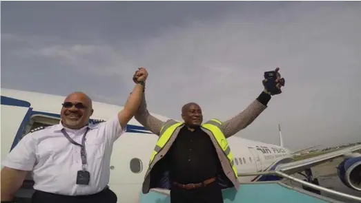  ??  ?? Air Peace Chief Pilot, Captain Victor Egonu celebratin­g with the airline's Chairman, Allen Onyema, during the delivery of Boeing B777 in Lagos