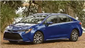  ??  ?? The Toyota Corolla compact sedan added a hybrid model as it entered its newest generation for 2020.