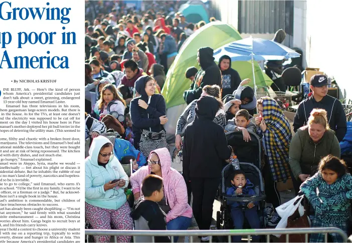  ?? (Lucy Nicholson/Reuters) ?? IMPOVERISH­ED CHILDREN and their families line up to receive free back-to-school supplies from the Fred Jordan Mission on Skid Row in Los Angeles last October.