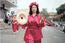  ?? MARK STRAW Heritage Portal ?? FEMALE Paraders marching with cymbals.. |