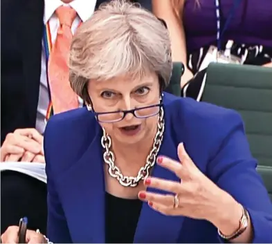  ??  ?? Instructio­ns: Mrs May tells the Liaison Committee yesterday about no-deal guidance for citizens