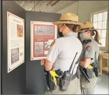  ?? ?? Yosemite Park Rangers get their first look at the new exhibit at the Yosemite History Center, the Chinese Laundry. Photo: Ellen Bergstone Wasil