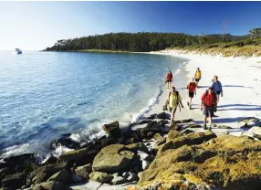  ??  ?? From left to below: Four Mile Beach, Maria Island; Views on Malabar walk day, Seven Peaks Walk © Luke Hanson/Pinetrees.Far right: Granite boulders at Tidal River on Wilsons Promontory.