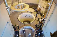  ?? Atomic Energy Organizati­on of Iran via AP ?? Technician­s work at a nuclear reactor near Arak, 150 miles southwest of the Iranian capital of Tehran, in 2019. The U.S. and Iran will begin indirect negotiatio­ns on the accord from which then-President Donald Trump removed the U.S.