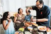  ??  ?? Chauhan, along with her husband, Vivek Deora, and their two children, make chaat at their Nashville home.