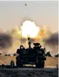  ??  ?? An Israeli artillery unit fires shells towards Gaza Strip