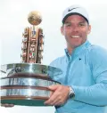  ??  ?? Victory: Paul Casey with the Porsche European Open title