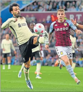  ?? AFP ?? Aston Villa’s Lucas Digne (R) vies with Liverpool’s Mohamed Salah (L) at Villa Park on Tuesday.