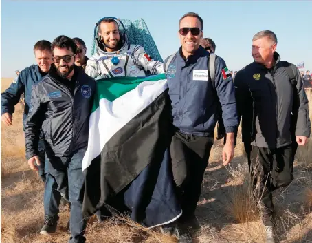  ?? AFP ?? UAE astronaut Hazza Al-Mansoori touched down in the Kazakh steppes with US astronaut Nick Hague and cosmonaut Alexey Ovchinin.