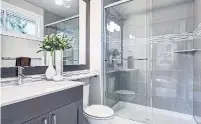  ?? DREAMSTIME ?? Walk-in showers are taking over from bathtubs in many hotels, and many apartment designers are doing away with tubs, too.