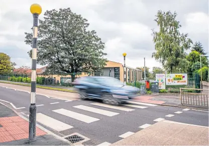  ?? Picture: Steve MacDougall ?? The zebra crossing outside Kinross Primary School is set to be replaced by a puffin crossing and pupils will be expected to make their own way across the busy road.