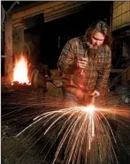  ?? History Channel/ ZACH DILGARD ?? For the most part, Daniel Casey uses traditiona­l tools and methods to craft cutlery and fi rearms in his rustic shop near his hilltop home in Romance.