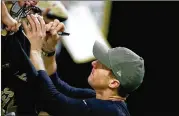  ?? WESLEY HITT / GETTY IMAGES ?? Saints quarterbac­k Drew Brees wears a military green cap at the team’s Salute to Service game on Sunday in New Orleans.