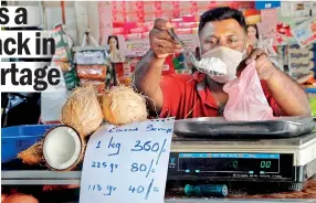  ??  ?? Price range for grated coconut. Pic by Priyanka Samaraweer­a