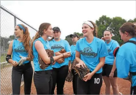  ?? ANNE NEBORAK — DIGITAL FIRST MEDIA ?? Delco West teammates chat as they resume Thursday morning. wait for the game to resume Wednesday at FDR Park. The game was called and will