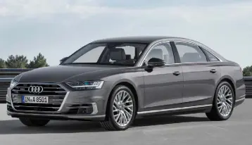  ??  ?? SUMPTUOUS: New Audi A8 is heaving with technology — and supremely comfortabl­e (below)