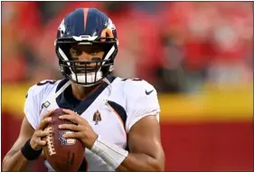  ?? RJ SANGOSTI — THE DENVER POST ?? Denver quarterbac­k Russell Wilson warms up before the game on Oct. 12in Kansas City, Mo.