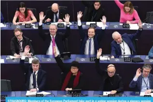  ?? ?? STRASBOURG: Members of the European Parliament take part in a voting session during a plenary session at the European Parliament in Strasbourg, eastern France, on March 13, 2024. — AFP