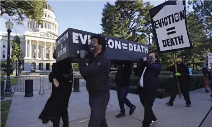  ?? Photograph: Rich Pedroncell­i/AP ?? Demonstrat­ors carried a mock casket past California’s capitol in January.
