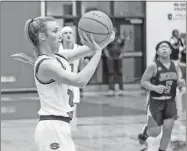  ?? Tim Godbee ?? Sonoravill­e junior Abby Chambers attempts a 3-point shot during the Lady Phoenix’s second-round playoff game against Jackson at Sonoravill­e High School on Wednesday.