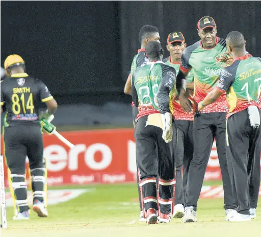  ?? IAN ALLEN/PHOTOGRAPH­ER ?? Members of the St Kitts and Nevis Patriots celebrate the dismissal of Dwayne Smith (left) from the Jamaica Tallawahs during a Caribbean Premier League (CPL) match played at Sabina Park on Thursday, September 19, 2019. The Patriots won by 20 runs.