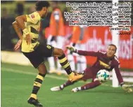  ?? – AFPPIX ?? Dortmund striker Pierre-Emerick Aubameyang (left) scores past Moenchengl­adbach’s goalkeeper Tobias Sippel during the German Bundesliga match in Dortmund yesterday.