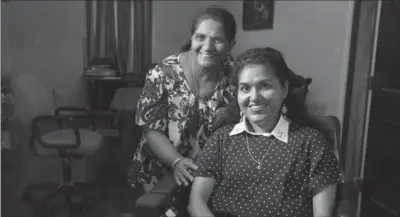  ?? KIM HAIRSTON, BALTIMORE SUN ?? Pushpa Krishnaswa­my, left, and her daughter, Kavita Krishnaswa­my, a PhD candidate in Computer Science at UMBC who is living with spinal muscular atrophy.