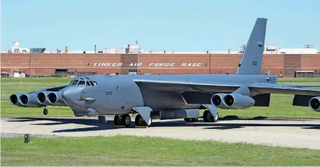  ?? [PHOTO BY GREG L. DAVIS, U.S. AIR FORCE] ?? A Boeing B-52H Stratofort­ress is parked on Tinker Air Force Base’s tarmac in 2017. CACI, which provides various services to intelligen­ce, defense and federal civilian customers, already has several hundred employees working for those customers in...