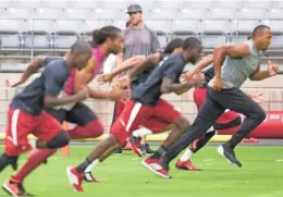  ?? PHOTOS BY CHERYL EVANS/AZCENTRAL SPORTS ?? TOP: Carrdinals cornerback Patrick Peterson arrives in a helicopter for the first day of training camp at University of Phoenix Stadium in Glendale on Thursday.