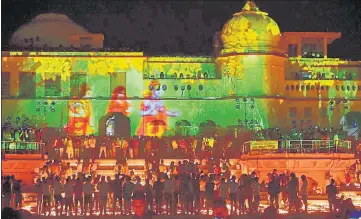  ??  ?? Devotees light earthen lamps on the bank of Saryu river during Deepotsav celebratio­ns in Ayodhya on Friday. The Uttar Pradesh government marked the occasion with a sound and light show, cultural programmes and the lighting of earthen lamps.