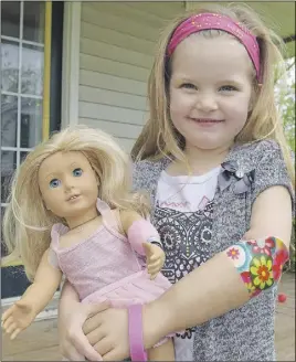  ?? Harry SulliVaN/truro Daily NewS ?? Jaelynn Creelman of Stewiacke was born without the lower portion of her left arm and like her doll, Chole, the four-year-old has a prosthetic limb, thanks to the War Amps program.