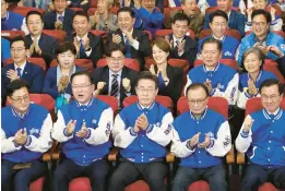  ?? CHUNG SUNG-JUN/POOL ?? South Korea’s Democratic Party leader Lee Jae-myung, center, and other candidates watch results of election exit polls Wednesday in Seoul, South Korea.