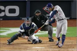  ?? ASSOCIATED PRESS ?? HOUSTON ASTROS’ GEORGE SPRINGER (4) connects for a three-run home run against the New York Yankees during the third inning of Game 4 of the American League Championsh­ip Series on Thursday in New York.