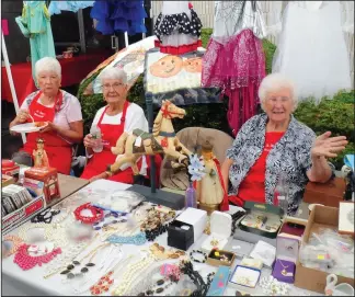  ?? Ernest A. Brown photo ?? Church volunteers, from left, Barbara Dziok, 78, of North Smithfield; Terry Roteski, 90, of Woonsocket; and Isabella Slowik, also 90, of Woonsocket, wait for customers at the thrift table with proceeds benefiting the parish fund during St. Stanilaus Catholic Church’s annual Polish Festival at the Parish Center on Church grounds in Woonsocket Saturday.