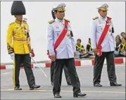  ?? SAKCHAI LALIT / ASSOCIATED PRESS ?? Thai PrimeMinis­ter Prayuth Chan-ocha (center) participat­es in the funeral procession and royal cremation ceremony of late Thai King Bhumibol Adulyadej on Oct. 26 in Bangkok.