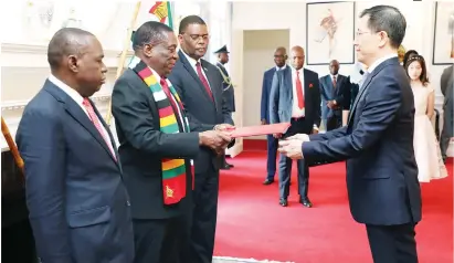  ?? — Picture by Tawanda Mudimu ( See story on Page 3) ?? PRESIDENT Mnangagwa (centre) welcomes the incoming Chinese Ambassador to Zimbabwe, Mr Guo Shaochun, while flanked by Foreign Affairs and Internatio­nal Trade Minister Dr Sibusiso Moyo (foreground) and permanent secretary Ambassador James Manzou at State House in Harare yesterday.