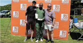  ?? MTIKI Picture: TK ?? CROWNED KING: Andile Motwana, 25, centre, of Nedbank Running Club, is crowned the 2022 Pineapple Run champion on Saturday after finishing the 27km run in just under an hour-and-a-half. Awarding Motwana the gold medal are BUCO’s Gerhard van der Walt, left, and Marius Schmidt