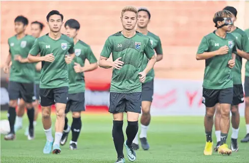  ?? ?? Thailand players train ahead of their match against the Philippine­s at the 2022 AFF Mitsubishi Electric Cup.