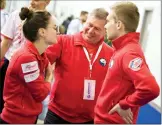  ?? Herald photo by Ian Martens ?? Team Croatia Neven Pufnik talks with his mixed doubles players Iva Roso and Mislav Martinic after their afternoon match with Belarus. @IMartens Herald
