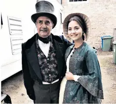  ??  ?? Jenna Coleman, as a possibly pregnant Queen Victoria, poses with her grandfathe­r