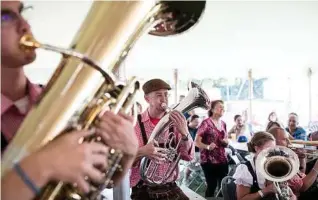  ??  ?? Musicians perform at the 150th anniversar­y party for Leinenkuge­l’s.