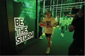  ?? TED S. WARREN — THE ASSOCIATED PRESS ?? Seattle Storm guard Sue Bird, center, walks out of the tunnel before a WNBA basketball game against the Minnesota Lynx, Wednesday, Aug. 3, 2022, in Seattle. Bird is retiring at the end of the 2022 season.